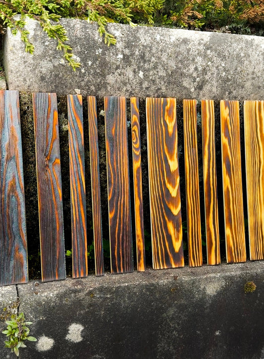 Wood panels burnt, highlighting the natural pattern of grain